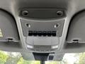 Overhead console of a 2020 Ford F-350 SD featuring multiple toggle switches and speaker grilles