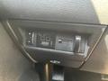 A dashboard control panel from a 2011 RAM 1500 featuring a digital display and adjustment slider for towing settings
