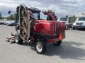 A red 2014 Toro Groundmaster 5910 turf maintenance vehicle with multiple mowing decks and an open hood revealing the engine compartment