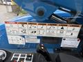 A control panel featuring various warning labels and operational instructions for a 2020 Genie GTH-5519 telehandler
