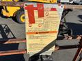 A warning sign on a 2010 Skyjack SJ lift detailing safety hazards and precautions for operation
