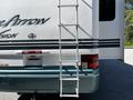 2000 Ford Motorhome with a ladder attached to the rear for access to the roof