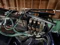 A 2018 Kenworth T800 truck's hydraulic control system featuring various hoses and valves with visible connectors and fittings