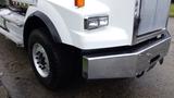 A 2019 Western Star Trucks 4900 with a chrome front bumper and large tire visible in the foreground