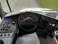 The interior dashboard of a 2013 International 4200 featuring various control buttons gauges and a steering wheel