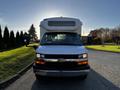 A 2017 Chevrolet Express van facing forward with a white exterior and black grille