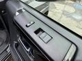Close-up view of the driver's side window control panel of a 2021 Toyota 4Runner featuring buttons for window operation