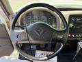 The image shows the steering wheel and dashboard of a 2009 International 7500 with various gauges and controls visible