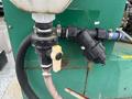 Close-up of a valve and connection on a 2011 Hightliner Aquacide Hot Water Weed Control Dual Flat Deck Trailer showing a black hose and fittings