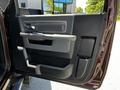 Interior door panel of a 2015 RAM 5500 featuring a door handle armrest and storage compartment