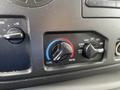 Control panel with temperature dials for a 2009 Ford Econoline featuring settings for cool and warm air along with air vent options