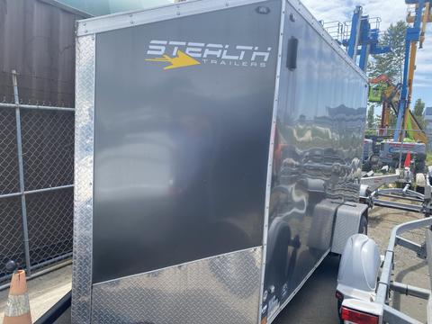 A 2020 Stealth Enterprises trailer with a metallic silver exterior featuring the logo "Stealth Trailers" on the side