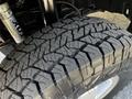 Close-up of a rugged tire with deep treads from a 2017 Mercedes-Benz Sprinter highlighting its durability and traction features