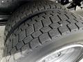 Close-up of the dual tires of a 2018 Hino 195 showcasing the tread pattern and rubber surface details
