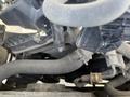 Close-up view of the engine components of a 2016 Ford Transit showing belts hoses and various mechanical parts
