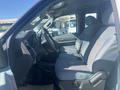 Interior of a 2014 Ford F-250 SD showing front seats with gray upholstery and dashboard with controls visible