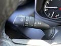 Close-up of the control stalk in a 2023 Toyota Tundra featuring settings for headlights and turn signals