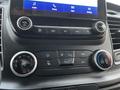 Dashboard controls of a 2020 Ford Transit with climate and audio settings buttons