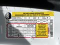 A 2022 Ford Transit with a tire and loading information label displaying seating capacity and cold tire pressure specifications