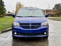 A blue 2020 Dodge Grand Caravan with a distinctive front grille and headlights facing forward