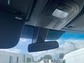 Interior view of a 2024 Mercedes-Benz Sprinter showing ceiling with lights and rearview mirror