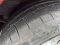 A close-up view of a worn tire from a 1970 Chevrolet Corvette showcasing tread patterns and dirt accumulation