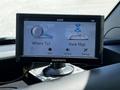 A Garmin GPS device displays options for navigation with buttons for "Where To" and "View Map" on the screen