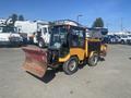 2010 Trackless MT6 utility vehicle equipped with a front plow blade designed for snow removal and municipal maintenance