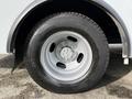 Close-up of the wheel of a 2019 Chevrolet Express featuring a silver rim and black tire with visible tread patterns