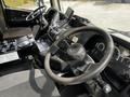 Interior view of a 2012 Autocar Xpert showing the driver's seat steering wheel and control panel