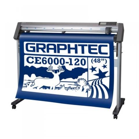 A Graphtec CE6000-120 cutting machine with a blue vinyl roll displaying a design featuring a deer and stars