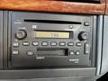 A black Volvo VR400 car stereo with buttons for volume, preset, and various audio functions showing the time as 739