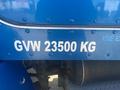 A blue 2008 Peterbilt 340 with a side panel displaying the text GVW 23500 KG in white letters