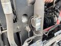 A close-up view of the engine compartment of a 2012 Toro Groundsmaster 5910 showing various mechanical components and wiring
