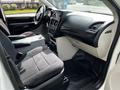Interior view of a 2011 Dodge Grand Caravan featuring a driver's seat, dashboard, and center console with storage compartments