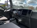 Interior view of a 2016 Isuzu NQR showing the dashboard steering wheel gear shift and controls