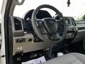 Interior view of a 2018 Ford F-550 showcasing the steering wheel dashboard controls and gear shift