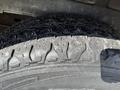 Close-up of a tire from a 2008 Ford Econoline showing tread patterns and wear indicators