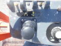 Control panel of a 2008 JLG Boom Lift featuring joystick knobs and directional indicators for operating the lift