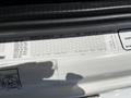 A close-up view of a 2016 Freightliner M2 106 vehicle information label with specifications for axle weights and tire sizes