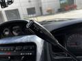 A close-up of a gear shift lever in a 2003 Mitsubishi Delica displaying the positions for On Off and OD
