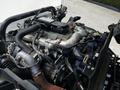 Close-up of the engine compartment of a 2020 Hino 155 showcasing various pipes wires and components of the engine