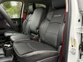Front seats of a 2024 RAM 5500 featuring leather upholstery and stitching details with a modern design