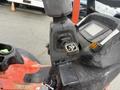 Close-up of the control panel on a 2015 Kubota F3990 featuring buttons and gauges indicating various functions and settings of the vehicle