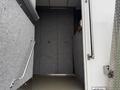 2011 Ford F-650 with an open door revealing a gray interior and a handrail on the side