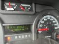Dashboard of a 2009 Ford Econoline showing speedometer trip meter and fuel gauge with readings of 65313 kilometers and 194829 kilometers