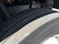 Close-up of a tire on a 2019 Freightliner MT45 showcasing the tread pattern and sidewall details