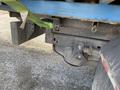 2009 Dodge Ram 5500 rear hitch and trailer connections with a green strap securing cargo