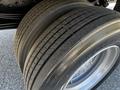 Close-up of a Hino 155 truck tire showing detailed tread pattern and wear on a dual rear tire setup