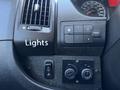 The control panel of a 2016 RAM Promaster featuring buttons for lights and climate control adjustments